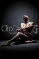 Nude female dancer froze in elegant pose