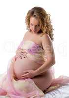 Beautiful pregnant woman bared her belly