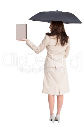 Businesswoman showing a book