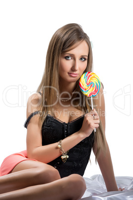 Sexy brunette with lollipop, isolated on white