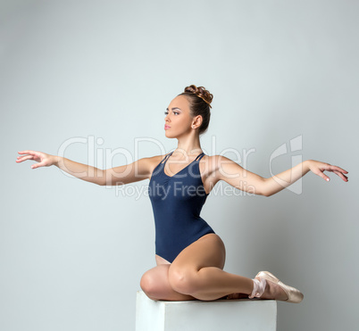 Attractive dancer posing gracefully waving hands