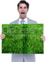 Man holding lawn book