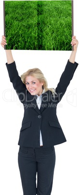 Woman holding up lawn book