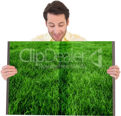 Man holding lawn book