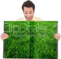 Man holding lawn book