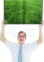 Man holding up lawn book