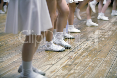 Girls in ballet school. Image of legs, close-up
