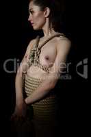 Woman tied with jute rope in style of Shibari