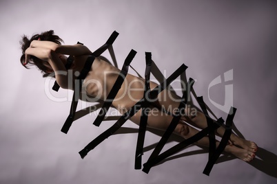 Sexual bondage as fetish. Nude girl with duct tape