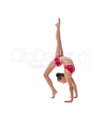 Female athlete performs gymnastic handstand