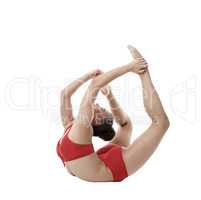 Cute gymnast doing exercise. Isolated on white