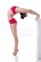 Gymnast arched her back while standing on tiptoe