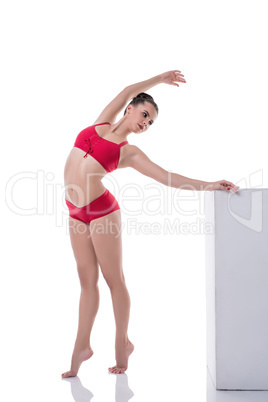 Graceful girl training while standing on tiptoe
