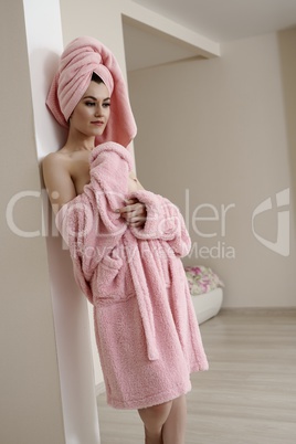 Beautiful young woman posing after taking bath