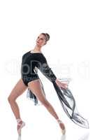 Elegant ballet dancer posing with flying cloth