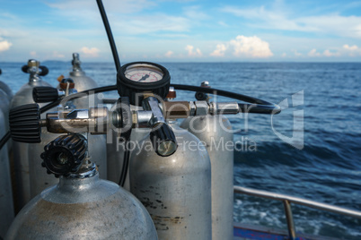 Diving equipment. Gas cylinders on sea backdrop