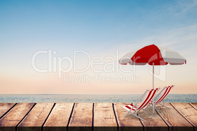 Composite image of image of sun lounger and sunshade