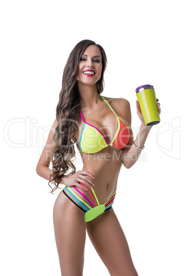 Fitness. Sexy female athlete posing with shaker