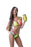 Fitness. Sexy female athlete posing with shaker