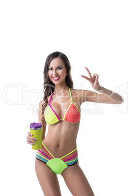 Sporty woman in bright bikini posing with shaker