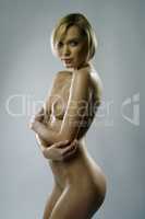 Image of sensual blonde posing naked at camera