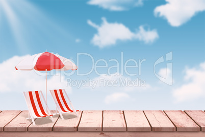 Composite image of image of sun lounger and sunshade