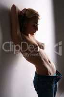 Blonde with beautiful bare chest posing in jeans