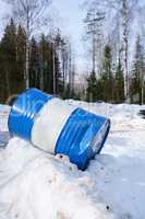 Image of striped barrel on snow in forest