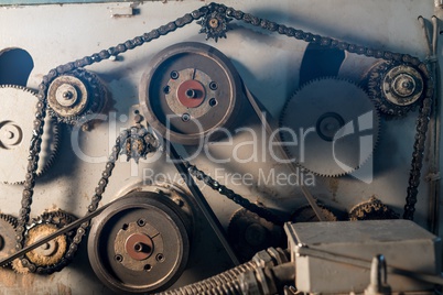 At sawmill. Gears and chain on machine