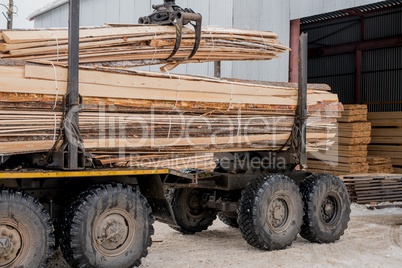 Sawmill. Image of truck transports boards