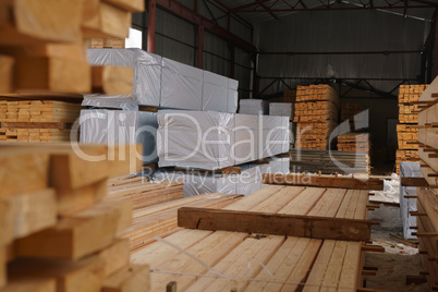 Warehouse at sawmill. Image of stacked boards