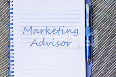 Marketing advisor write on notebook