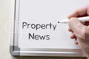 Property news written on whiteboard