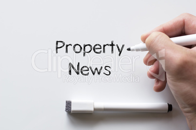 Property news written on whiteboard