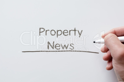 Property news written on whiteboard