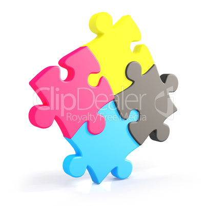 Four assembling colorful puzzle pieces in cmyk