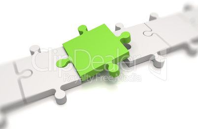 Focus on a green puzzle pieces