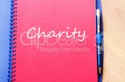 Charity write on notebook