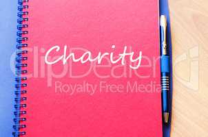 Charity write on notebook