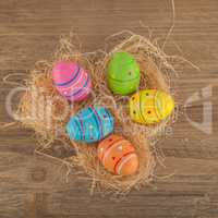 colourful easter eggs in a nest