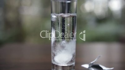 Aspirin or Effervescent  tablet  dissolving in glas water