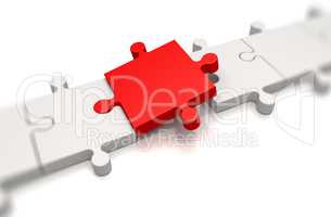 Focus on a red puzzle pieces