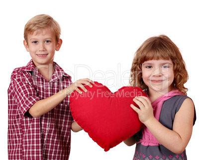 boy and little girl holding big red heart