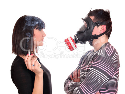 man with gas mask protects against tobacco smoke