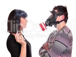 man with gas mask protects against tobacco smoke