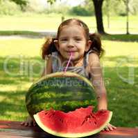 beauty little girl with watermelon summer scene