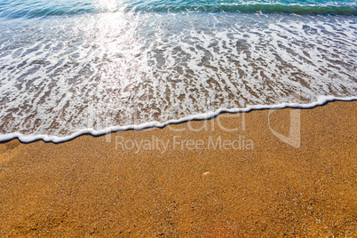 Soft wave of the sea on the sandy beach