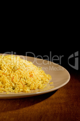 Risotto with Saffron on wooden table