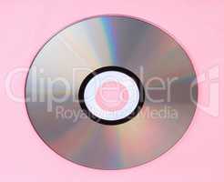 compact disc on pink background