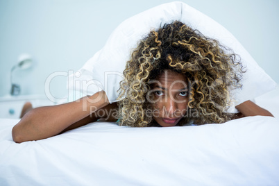 Young woman relaxing on bed